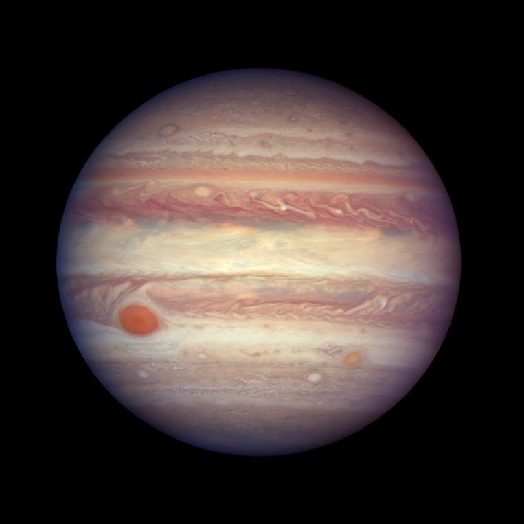 Jupiter as imaged by the Hubble Space Telescope.  On the left, just below center, is the large red spot Image NASA/ESA