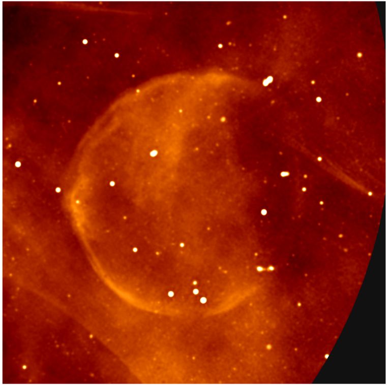 The spherical remains of a dying star.  On the right, you can also see a line, supposedly drawn by an object emitting radio radiation and traveling through the Milky Way at lightning speed.  Image credit: I. Heywood, SARAO.