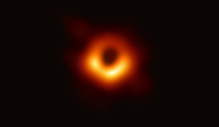 The first image of a black hole: a supermassive object surrounded by hot white plasma in the galaxy M87.  The image was taken on April 10, 2019 by the Event Horizon Telescope.  The 347 participating scientists were awarded the Breakthrough Prize in Fundamental Physics.  Photo by Agence France-Presse / European Southern Observatory