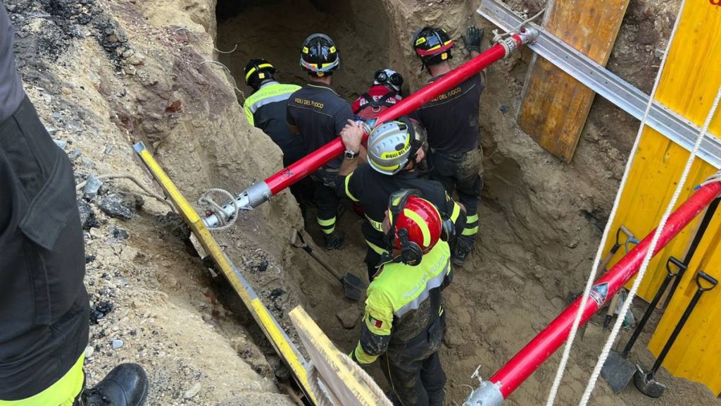 A man is rescued from a collapsed tunnel in Rome that he may have dug to rob a bank
