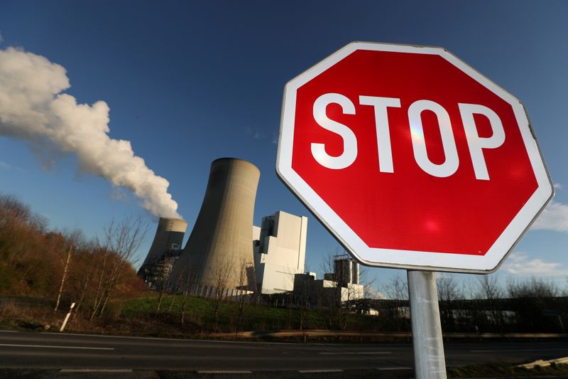 FILE PHOTO: Stop sign stands in front of the Neurath lignite power plant