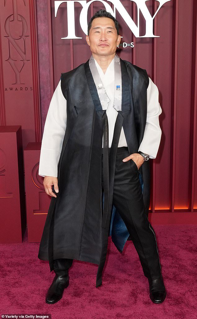 Actor Daniel Day Kim has reached black shorts black dress and a white shirt down-which is paired with a jacket over the top containing pieces of fabric hanging on his ankles