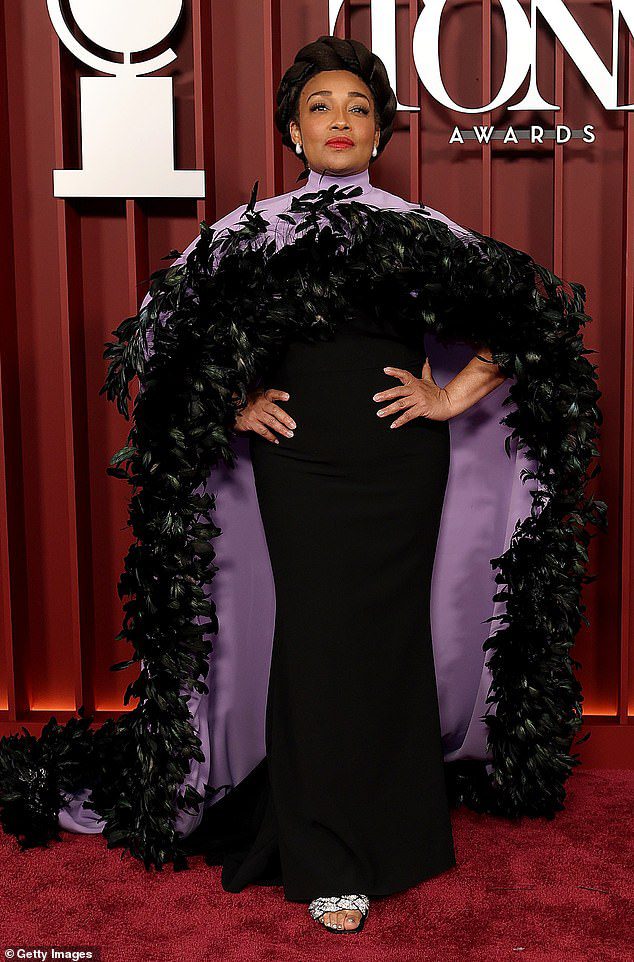 Natalie Vinte Bilcon of Natalie Fentea Bilcon chose a black dress with a purple head coat that contains a dramatic black feathers to hang out
