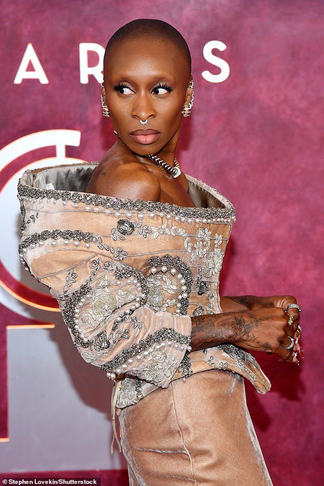 She paired the shirt - which was huge and appropriate on its frame - with a silk skirt with the length of the earth